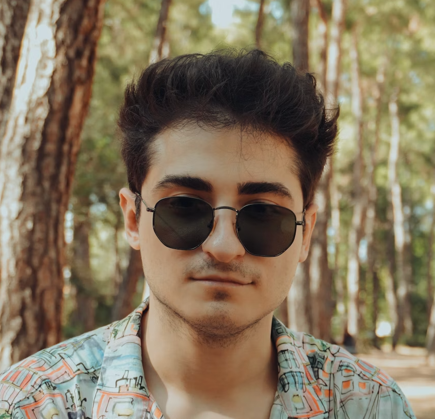 guy in a blue shirt and glasses