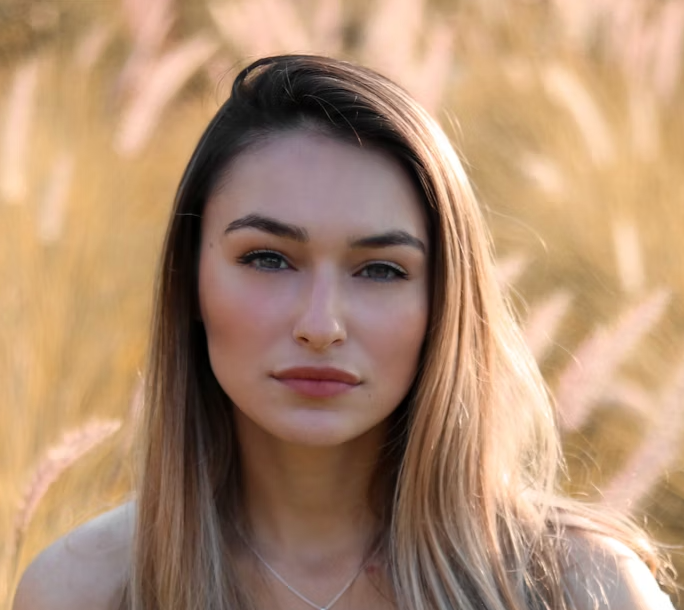 woman with blond hair on a background of spikelets